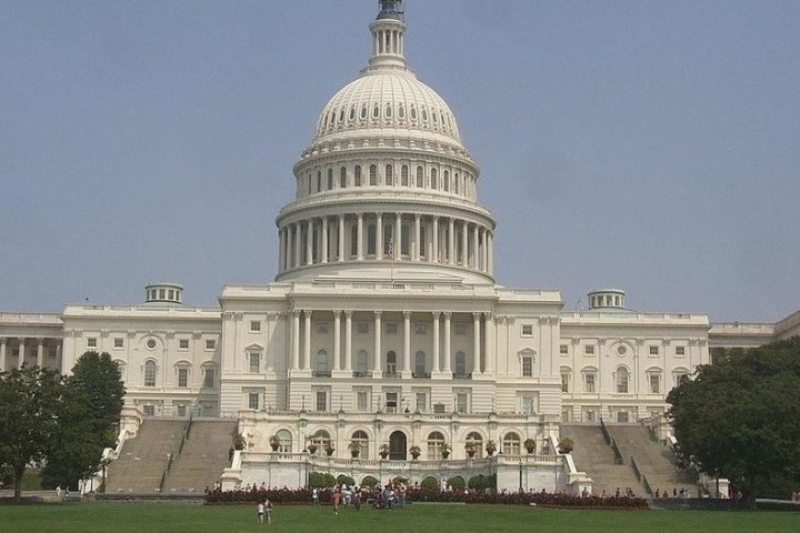 Front view of the U.S. Capitol building on a clear day.